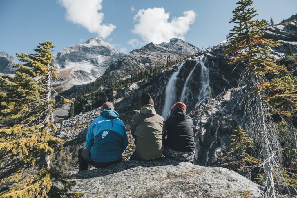 Canada, British Columbia, Glacier National Park, three hikers resting at Sir Donald Trail